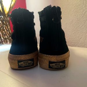 I am selling pink glitter and black vans New not used at all